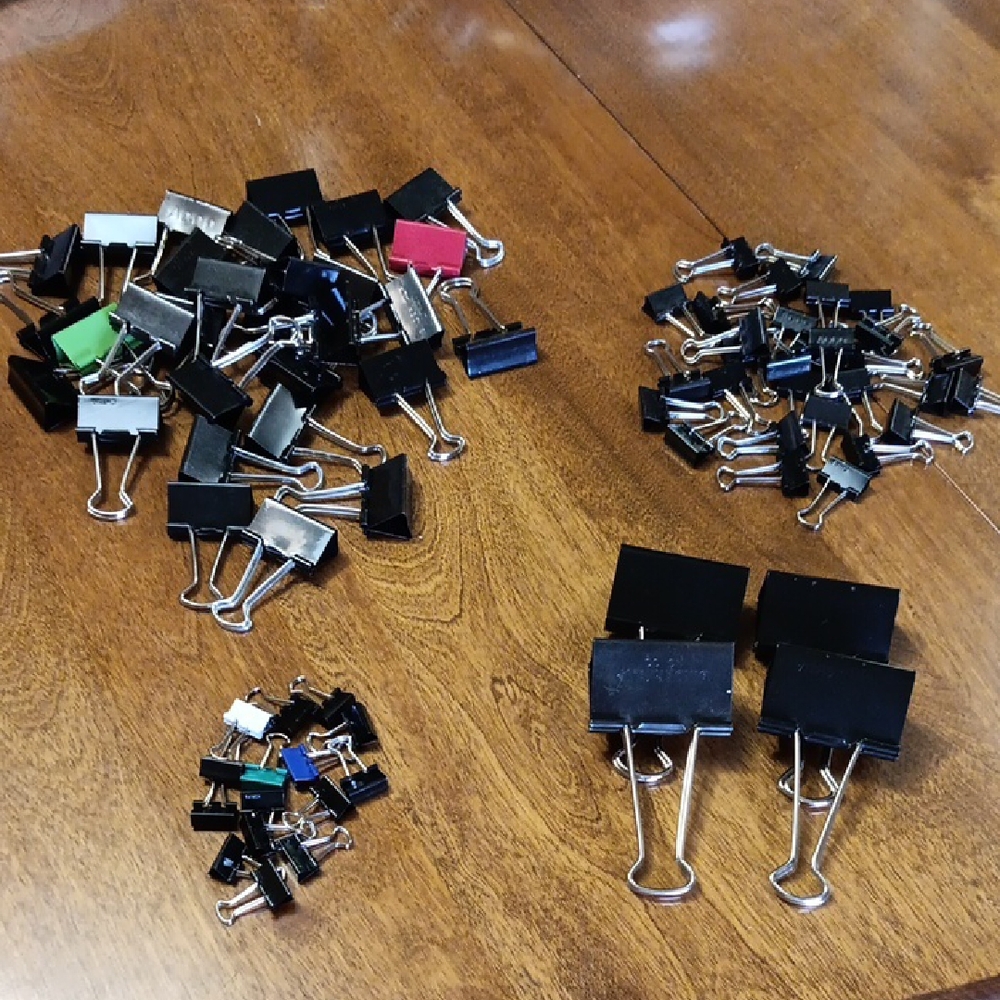 Assorted size binder paper  Clips